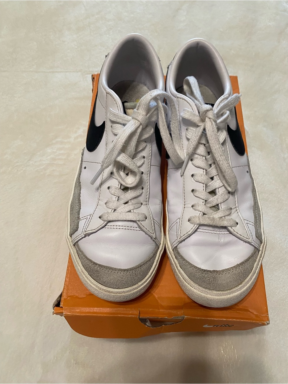 Nike White Sneakers with Black Swoosh and Gray Suede